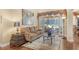 Living room with hardwood floors, comfy couch and pool view at 3861 Royal Hammock Blvd, Sarasota, FL 34240