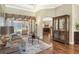 Living area with hardwood floors, cozy seating, and view of pool at 3861 Royal Hammock Blvd, Sarasota, FL 34240