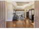 Open living room with hardwood floors and access to screened lanai at 3861 Royal Hammock Blvd, Sarasota, FL 34240