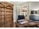Spacious home office with built-in wooden bookcases and dual computer setup at 3861 Royal Hammock Blvd, Sarasota, FL 34240