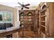 Home office with built-in bookcases and large desk at 3861 Royal Hammock Blvd, Sarasota, FL 34240
