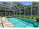 Large screened pool and spa with patio and lush landscaping at 3861 Royal Hammock Blvd, Sarasota, FL 34240
