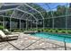 Screened pool and spa with spacious patio area at 3861 Royal Hammock Blvd, Sarasota, FL 34240