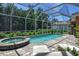 Inviting screened pool and spa with patio seating at 3861 Royal Hammock Blvd, Sarasota, FL 34240