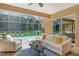 Relaxing screened lanai with seating and view of the pool at 3861 Royal Hammock Blvd, Sarasota, FL 34240