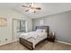 Spacious bedroom with a large window and ceiling fan at 3911 Penrod Ln, Valrico, FL 33596