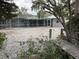 Backyard with wooden dock and gravel at 417 Avenida De Mayo, Sarasota, FL 34242
