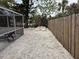 Large backyard with gravel and wooden fence at 417 Avenida De Mayo, Sarasota, FL 34242