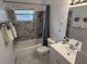 Bathroom with a tub, shower, and modern vanity at 417 Avenida De Mayo, Sarasota, FL 34242