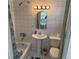 Clean bathroom with a pedestal sink, toilet and bathtub at 417 Avenida De Mayo, Sarasota, FL 34242