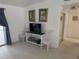 Living area with TV, console table, and two chairs at 417 Avenida De Mayo, Sarasota, FL 34242