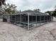 Screened pool area with lounge chairs at 417 Avenida De Mayo, Sarasota, FL 34242