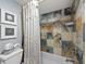 Bathroom with shower/tub combo and patterned shower curtain at 4215 Gulf Of Mexico Dr # 103, Longboat Key, FL 34228
