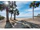 Peaceful beach access with a paved walkway, offering scenic ocean views at 4215 Gulf Of Mexico Dr # 103, Longboat Key, FL 34228