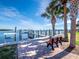 Relaxing boat dock with a bench and scenic waterway views at 4215 Gulf Of Mexico Dr # 103, Longboat Key, FL 34228