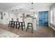 Kitchen with white cabinets, granite countertops and breakfast bar at 4215 Gulf Of Mexico Dr # 103, Longboat Key, FL 34228