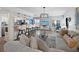 Open concept living room and kitchen with hardwood floors and breakfast bar at 4215 Gulf Of Mexico Dr # 103, Longboat Key, FL 34228