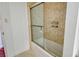 Clean bathroom with a tub and sliding glass shower doors at 435 S Gulfstream Ave # 1004, Sarasota, FL 34236