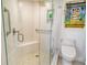 Modern bathroom with a walk-in shower, toilet and decorative wall art at 435 S Gulfstream Ave # 1004, Sarasota, FL 34236