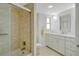 Bathroom with a tub/shower combo and white vanity at 435 S Gulfstream Ave # 1004, Sarasota, FL 34236