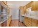 Modern kitchen with stainless steel appliances and light wood cabinets at 435 S Gulfstream Ave # 1004, Sarasota, FL 34236