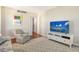 Living Room with comfy seating, large TV and access to closet at 435 S Gulfstream Ave # 1004, Sarasota, FL 34236