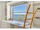 Home office with water view, built-in shelves and desk at 435 S Gulfstream Ave # 1004, Sarasota, FL 34236
