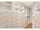 Large walk-in closet with ample shelving and drawers at 435 S Gulfstream Ave # 1004, Sarasota, FL 34236