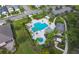 Community pool and playground with surrounding homes visible from above at 4755 Woodbrook Dr, Sarasota, FL 34243