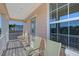 Private balcony with seating and a view of the neighborhood at 4755 Woodbrook Dr, Sarasota, FL 34243