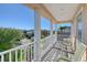 Relaxing balcony with white railings and comfortable seating at 4755 Woodbrook Dr, Sarasota, FL 34243