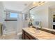 Clean bathroom with marble vanity and bathtub at 4755 Woodbrook Dr, Sarasota, FL 34243