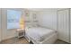 Charming bedroom with a bed and nightstand at 4755 Woodbrook Dr, Sarasota, FL 34243