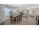 Dining room with hardwood floors and six-chair table at 4755 Woodbrook Dr, Sarasota, FL 34243