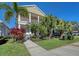 Two-story house with front porch, landscaping, and walkway at 4755 Woodbrook Dr, Sarasota, FL 34243