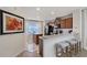 Modern kitchen with granite counters, dark wood cabinets, and black appliances at 4755 Woodbrook Dr, Sarasota, FL 34243