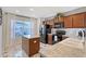 Modern kitchen boasts granite countertops, dark wood cabinets, and a breakfast bar at 4755 Woodbrook Dr, Sarasota, FL 34243