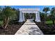 Elegant walkway leading to community pool area at 4755 Woodbrook Dr, Sarasota, FL 34243