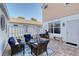 Relaxing patio with seating area and brick pavers at 4755 Woodbrook Dr, Sarasota, FL 34243