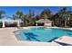 Resort-style community pool with adjacent cabana at 4755 Woodbrook Dr, Sarasota, FL 34243