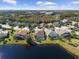 Aerial view showcasing home's private pool and lakefront location at 4831 Boston Common Gln, Bradenton, FL 34211