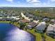 Aerial view of community, highlighting lakefront homes at 4831 Boston Common Gln, Bradenton, FL 34211
