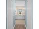 Double vanity bathroom with white cabinets and a large walk-in shower at 4831 Boston Common Gln, Bradenton, FL 34211