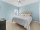 Bedroom with king-size bed and light blue walls at 4831 Boston Common Gln, Bradenton, FL 34211