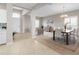 Open dining area with wood table and view into the living room at 4831 Boston Common Gln, Bradenton, FL 34211