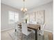 Formal dining room with neutral decor and a chandelier at 4831 Boston Common Gln, Bradenton, FL 34211