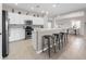 Modern kitchen with stainless steel appliances and an island with seating at 4831 Boston Common Gln, Bradenton, FL 34211