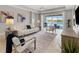 Spacious living room with white sofa and view of pool at 4831 Boston Common Gln, Bradenton, FL 34211