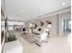 Open and airy living room with neutral colors, comfortable seating, and large windows at 4831 Boston Common Gln, Bradenton, FL 34211
