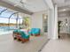 Relaxing pool area with patio furniture and screened enclosure at 4831 Boston Common Gln, Bradenton, FL 34211